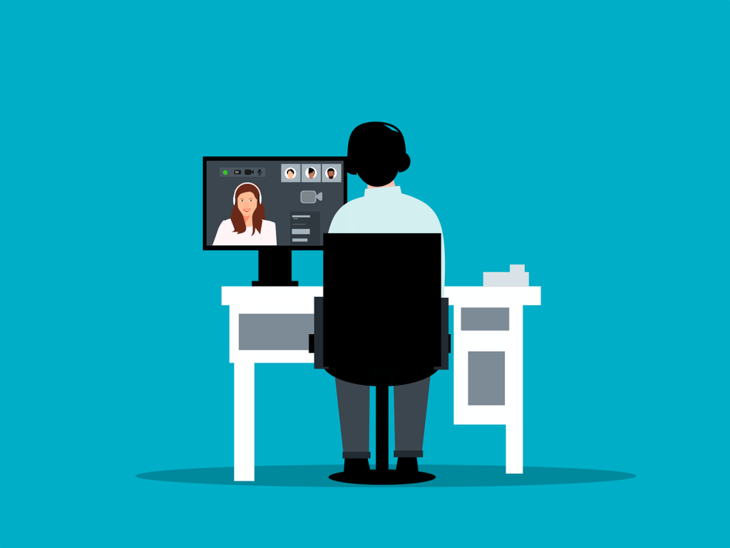 An illustration of a person working at a desk on a remote video call. Image used for blog about how work has changed by Desks by The Day